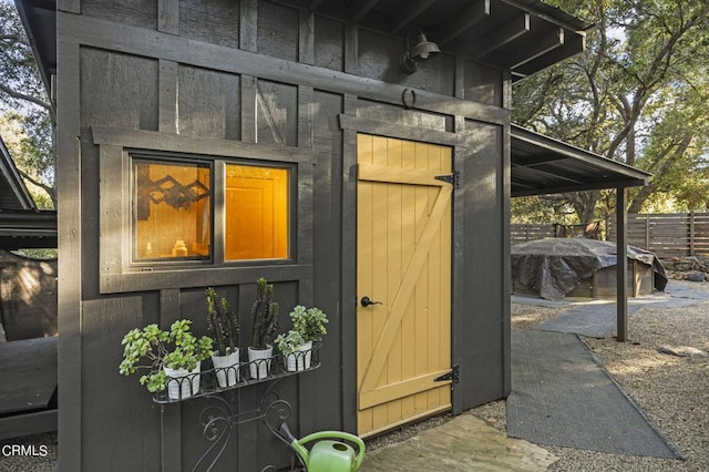 view of outbuilding with a fireplace