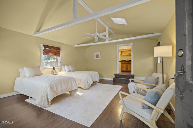 bedroom featuring ceiling fan, dark hardwood / wood-style floors, and lofted ceiling with skylight