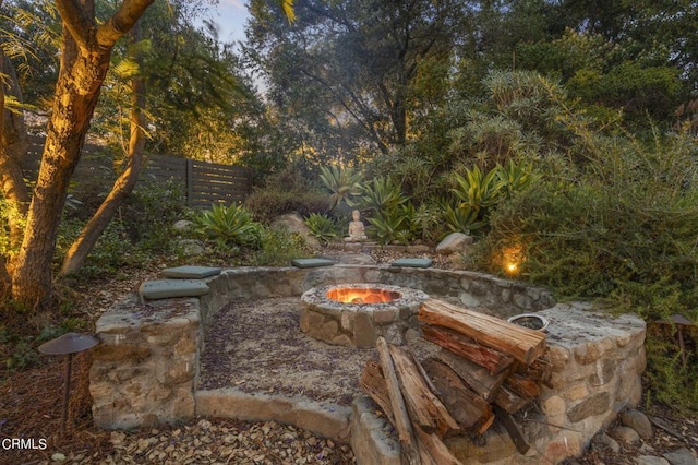 view of patio with a fire pit