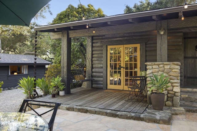 view of patio / terrace with french doors and a deck