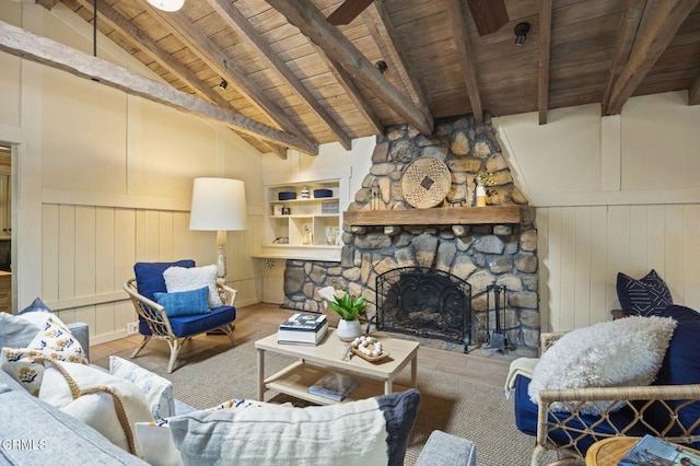 living room featuring wood-type flooring, vaulted ceiling with beams, a fireplace, and wood ceiling