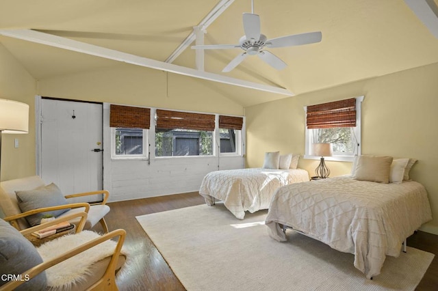 bedroom featuring ceiling fan, vaulted ceiling with beams, and dark hardwood / wood-style flooring