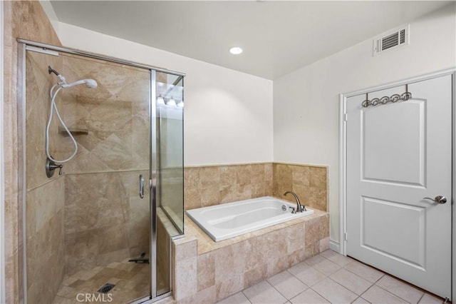 bathroom with tile patterned flooring and independent shower and bath