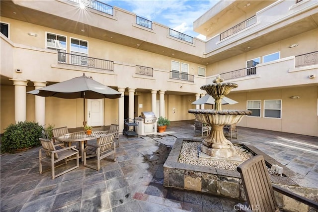 view of patio featuring a grill