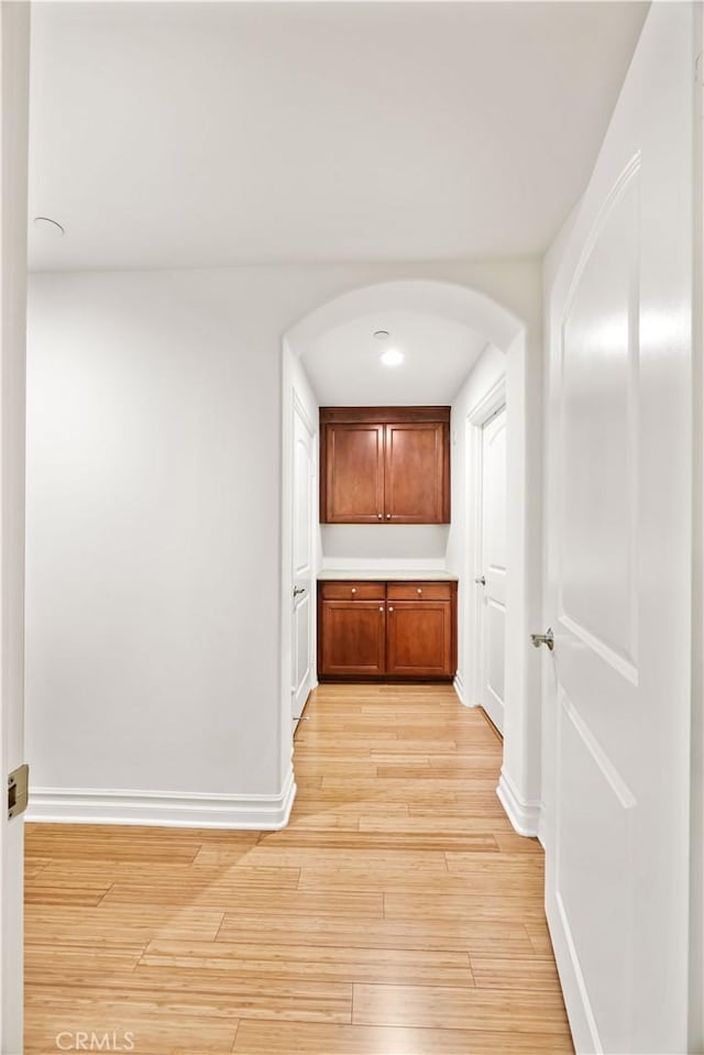 hall with light hardwood / wood-style flooring