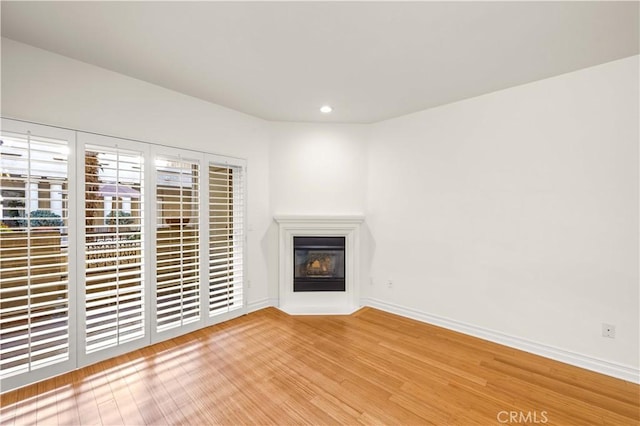 unfurnished living room featuring light wood-type flooring