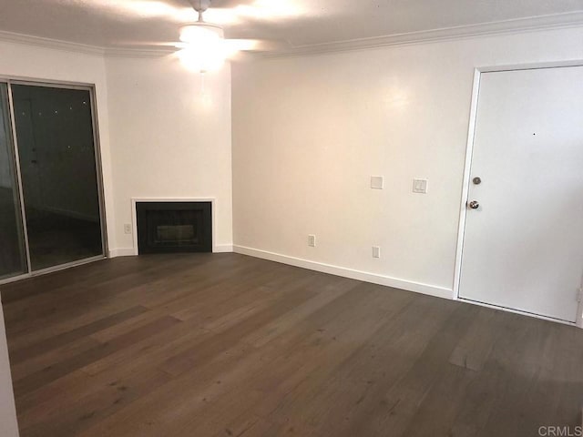 unfurnished living room with dark hardwood / wood-style floors, ceiling fan, and crown molding