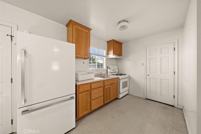 kitchen with sink and white appliances