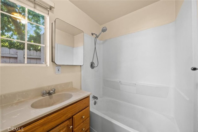 bathroom featuring shower / tub combination and vanity