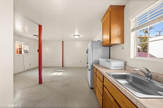 kitchen with sink and white refrigerator