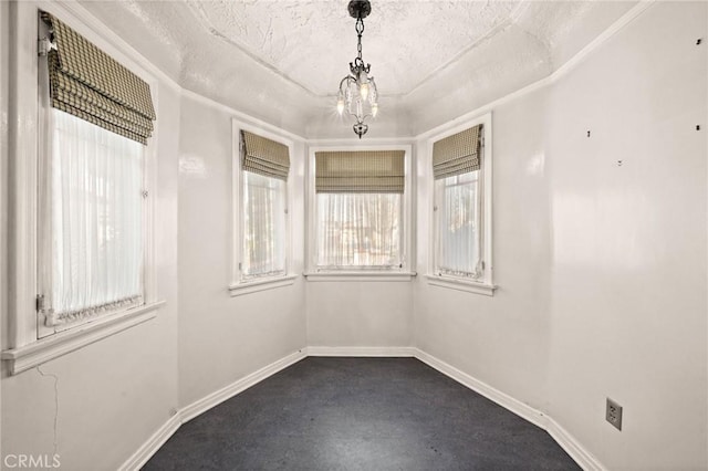 spare room with a textured ceiling