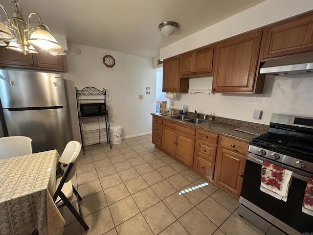 kitchen featuring sink, stainless steel appliances, ventilation hood, a chandelier, and light tile patterned floors