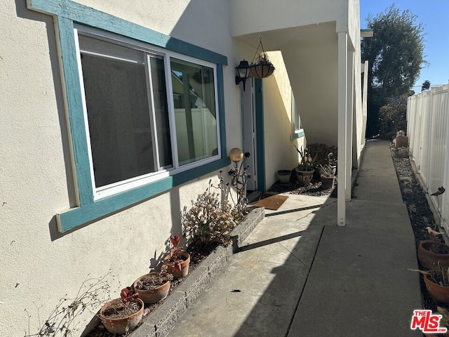 view of side of property with a patio area