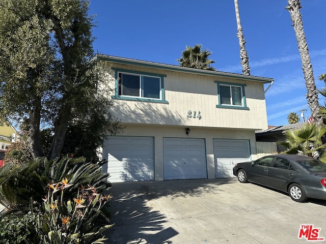 front facade with a garage