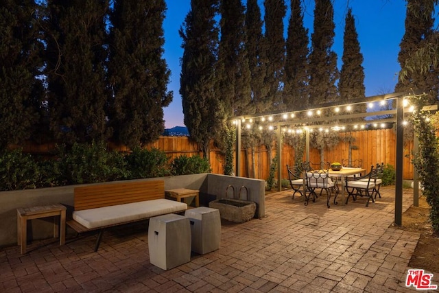 view of patio terrace at dusk