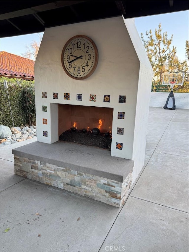 garage with an outdoor fireplace