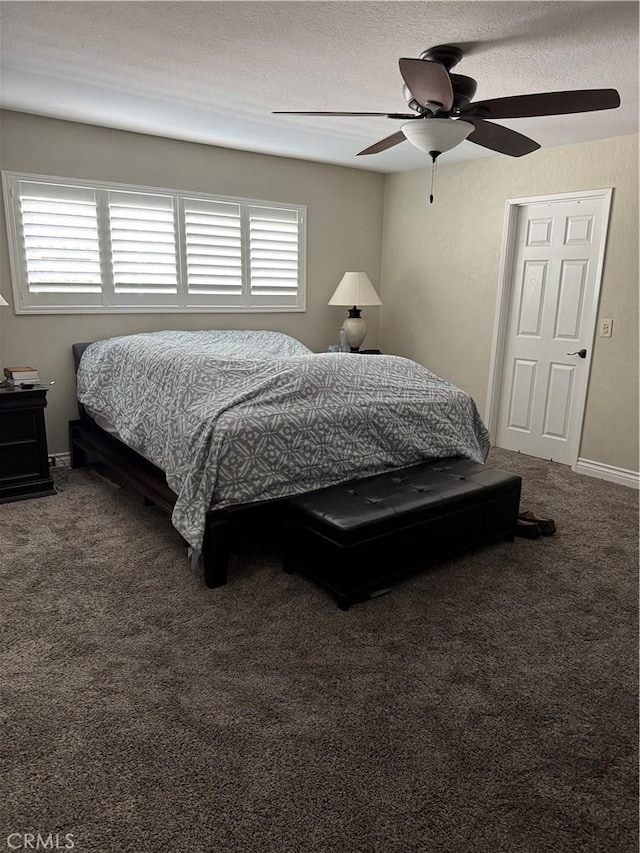 bedroom featuring ceiling fan and carpet