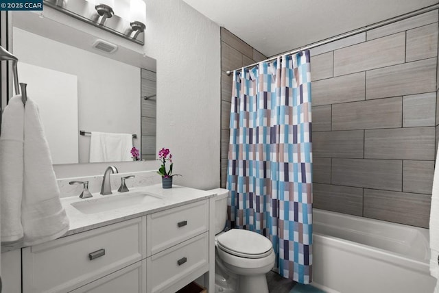 full bathroom featuring toilet, vanity, and shower / bathtub combination with curtain