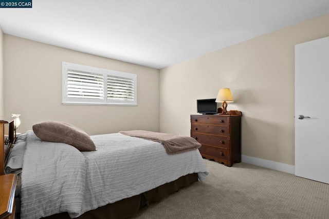 bedroom with light colored carpet