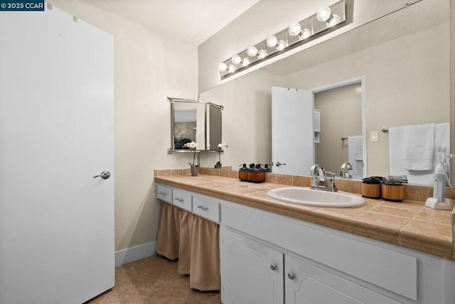 bathroom featuring vanity and tile patterned flooring