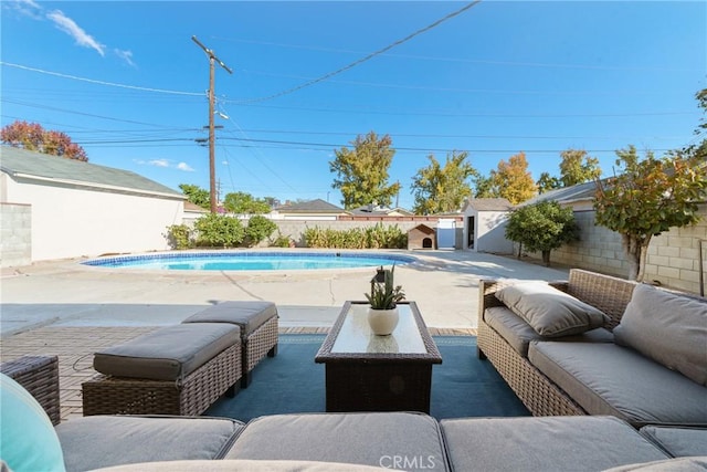 view of swimming pool featuring outdoor lounge area and a patio