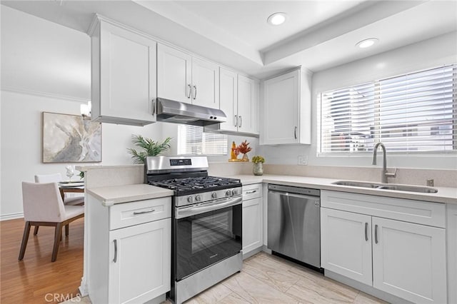 kitchen featuring white cabinets, sink, and stainless steel appliances