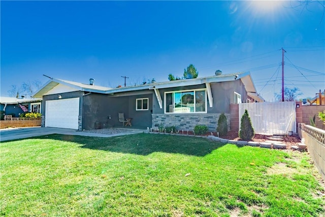 ranch-style house with a garage and a front lawn