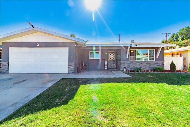 ranch-style home featuring a garage and a front lawn