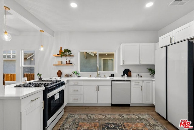 kitchen with dishwasher, white cabinets, sink, range with gas stovetop, and decorative light fixtures