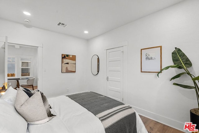 bedroom featuring wood-type flooring