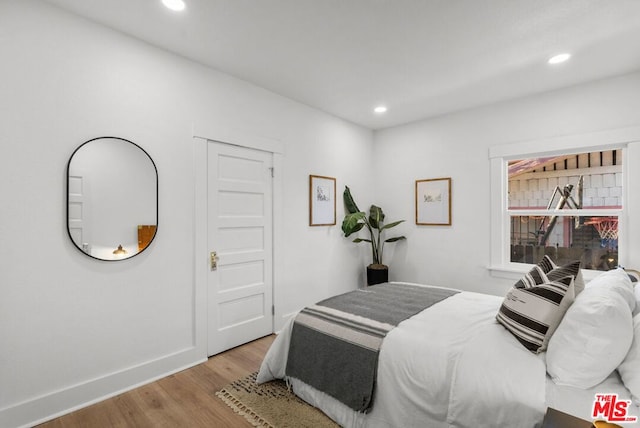 bedroom featuring light hardwood / wood-style floors