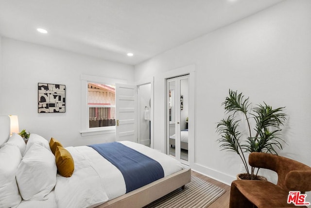 bedroom with hardwood / wood-style flooring