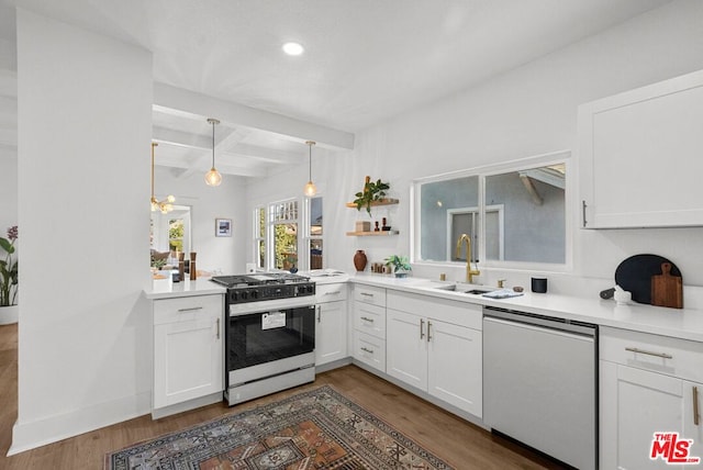 kitchen featuring white cabinetry, sink, beamed ceiling, dark hardwood / wood-style floors, and appliances with stainless steel finishes