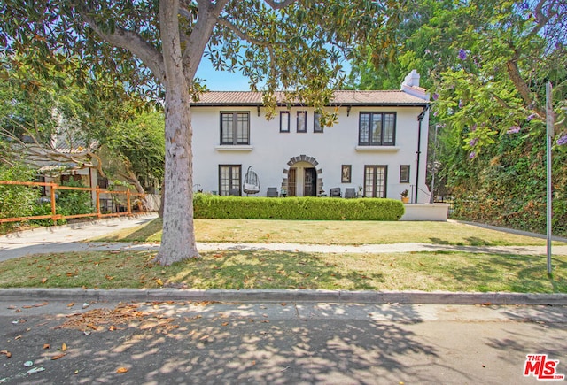 view of front of home with a front lawn