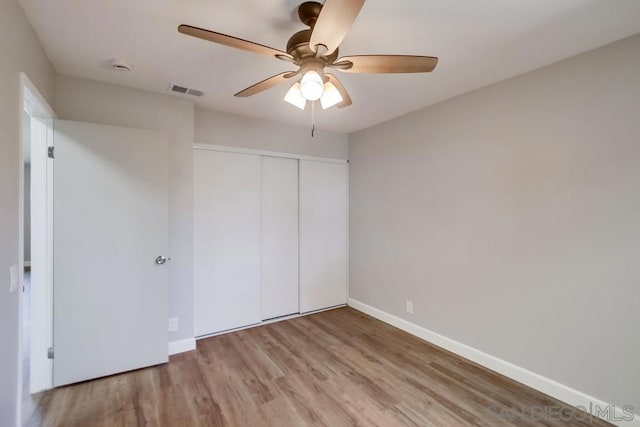 unfurnished bedroom featuring a closet, ceiling fan, and light hardwood / wood-style floors