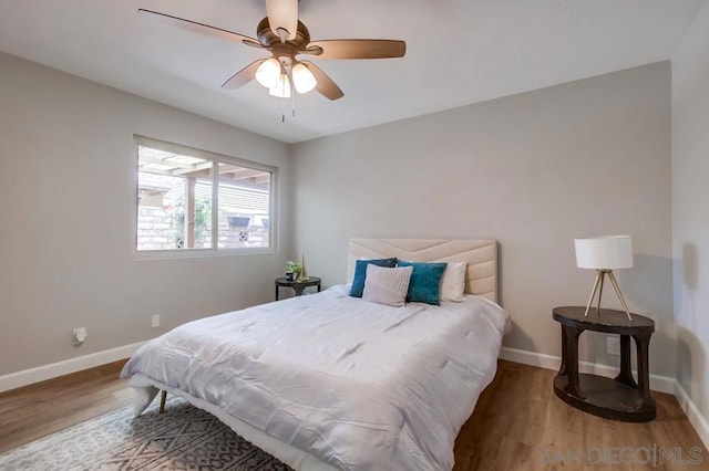 bedroom featuring wood-type flooring and ceiling fan