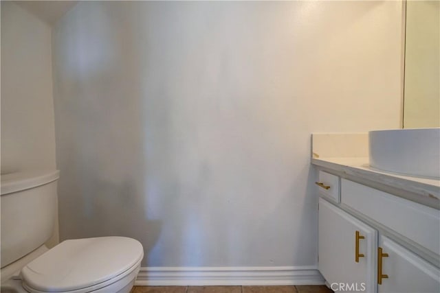 bathroom with toilet and vanity