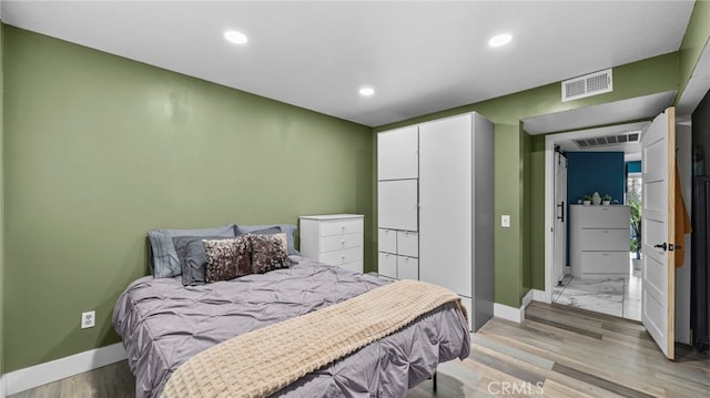 bedroom featuring light hardwood / wood-style flooring