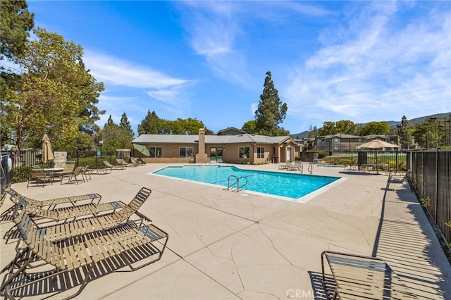 view of swimming pool featuring a patio