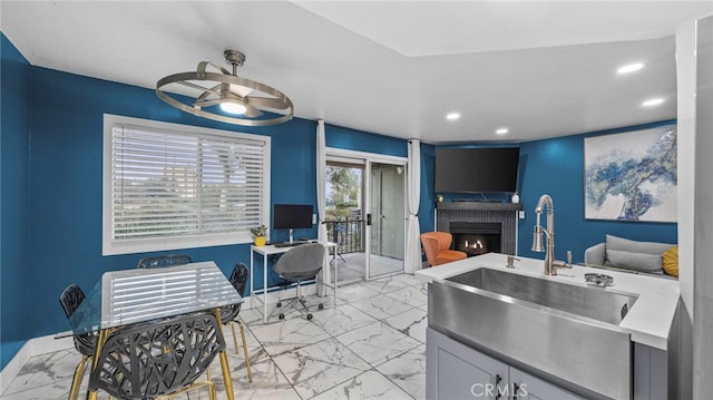 kitchen with ceiling fan and sink