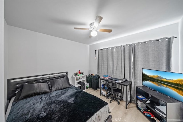 bedroom featuring light hardwood / wood-style flooring and ceiling fan