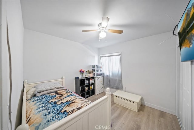 bedroom featuring ceiling fan and light hardwood / wood-style floors