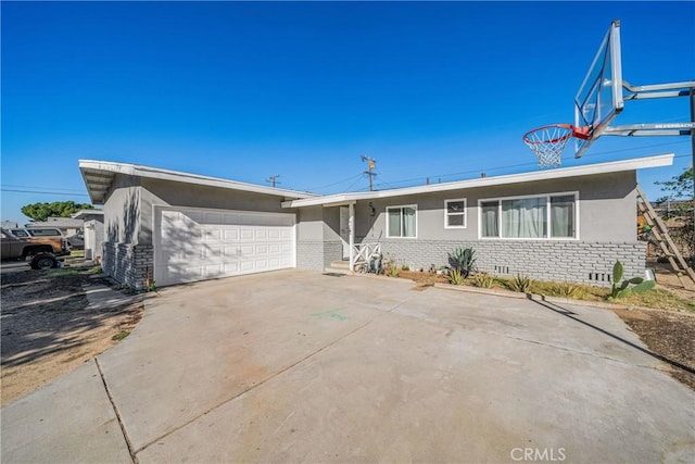 ranch-style home featuring a garage