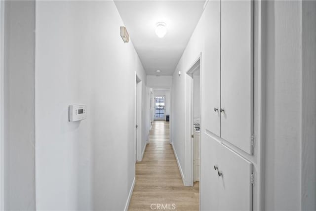 corridor featuring light wood-type flooring