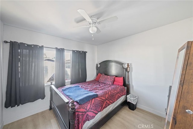 bedroom with light wood-type flooring and ceiling fan