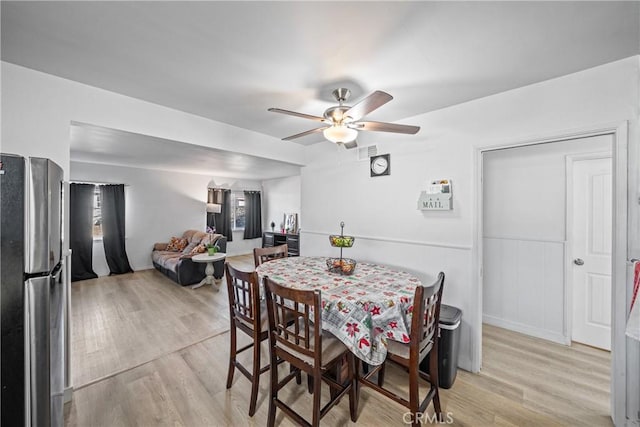 dining room featuring ceiling fan and light hardwood / wood-style flooring