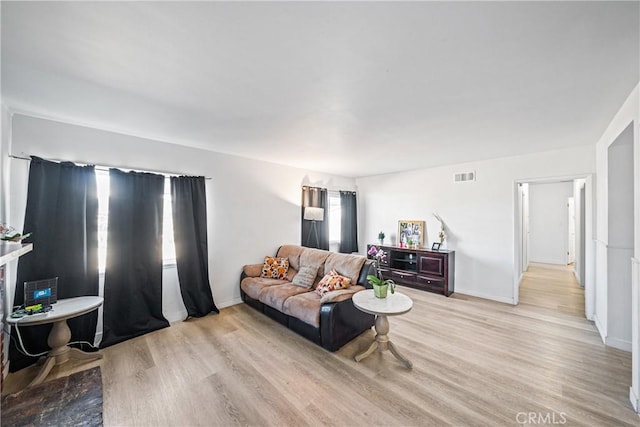 living room with light hardwood / wood-style floors