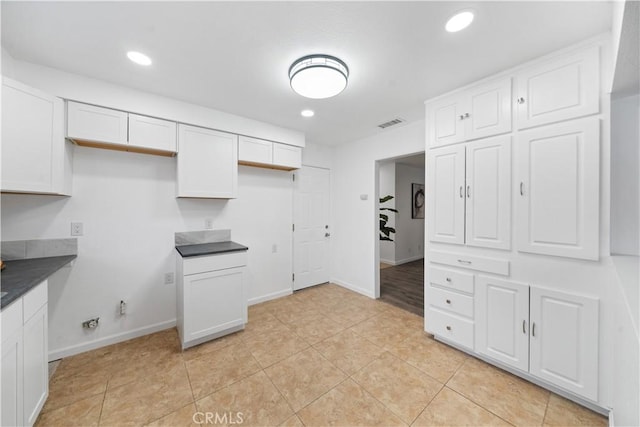 kitchen featuring white cabinetry