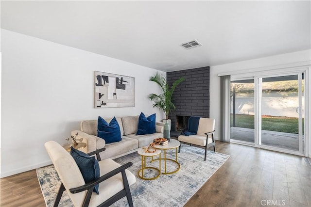 living room featuring a fireplace and hardwood / wood-style floors