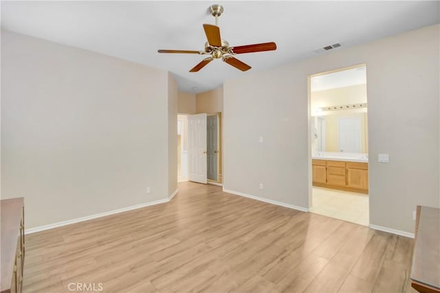 unfurnished bedroom with ensuite bathroom, light hardwood / wood-style flooring, and ceiling fan